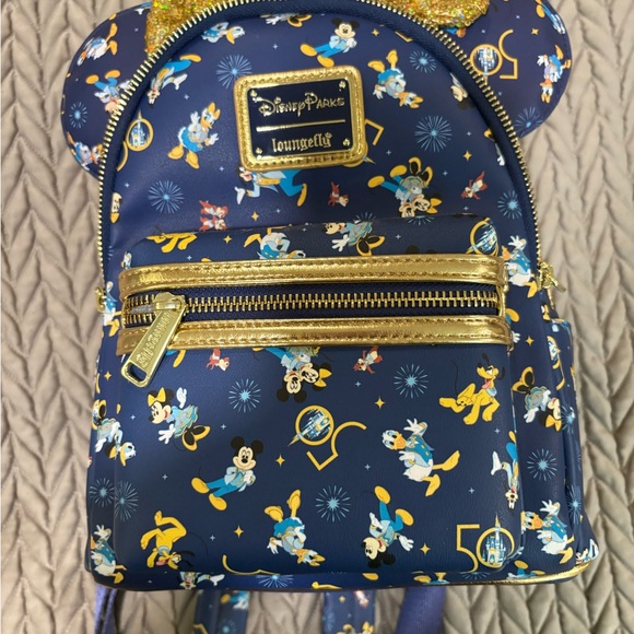 Disney world 50th anniversaryBlue and Gold Mini loungefly with matching ears